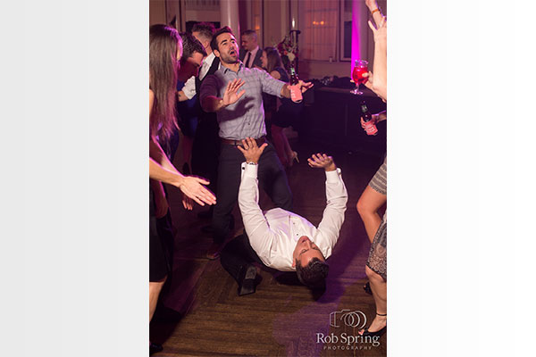 Guy dancing at wedding by Rob Spring Photography