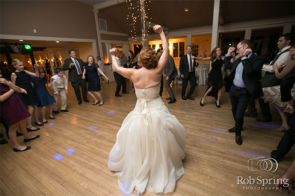 Bride dancing on dance floor by Rob Spring Photography