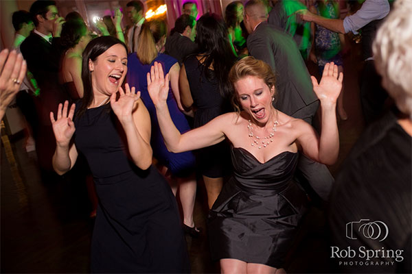 Girls dancing at party by Rob Spring Photography