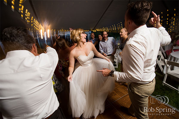 Bride dancing at wedding by Rob Spring Photography