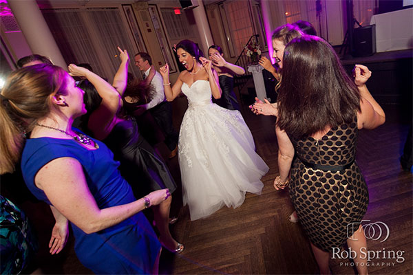 Bride dancing at wedding by Rob Spring Photography