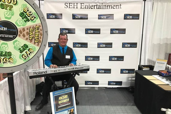 Scott E. Hemming at SEH Entertainment booth wheel game