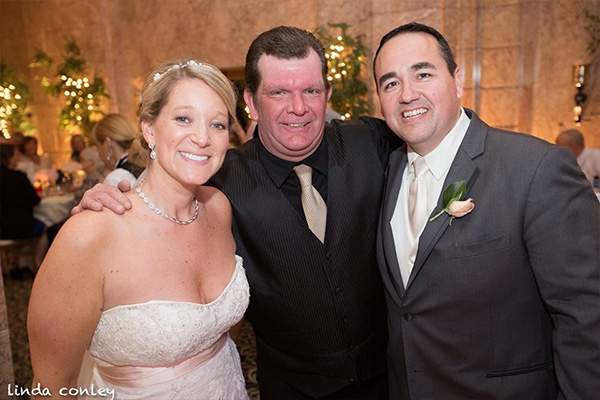 Scott E. Hemming with bride and groom
