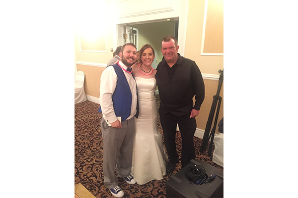 Scott E. Hemming with bride and groom