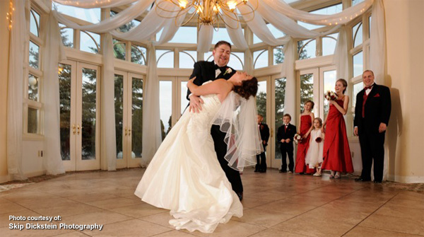 Bride and groom dancing after wedding by Skip Dickstein Photography