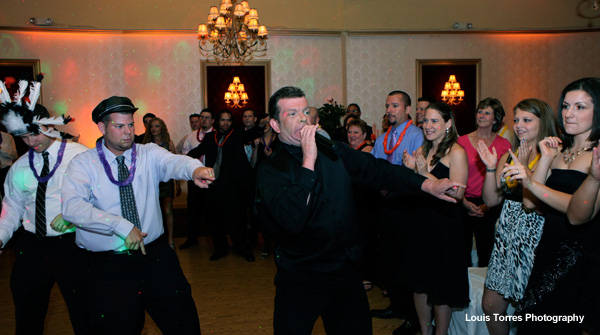 DJ Scott E. Hemming announcing at wedding on dance floor by Louis Torres Photography