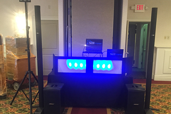 DJ booth event setup with blue lights