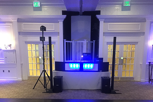 Blue up lighting DJ booth setup