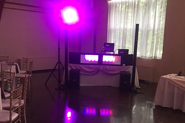 DJ booth with pink lighting
