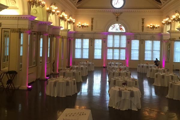 Pink accent up lighting at wedding