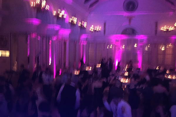Pink up lighting at wedding reception