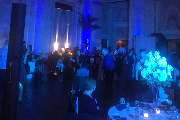 Blue up lighting at wedding reception dance floor